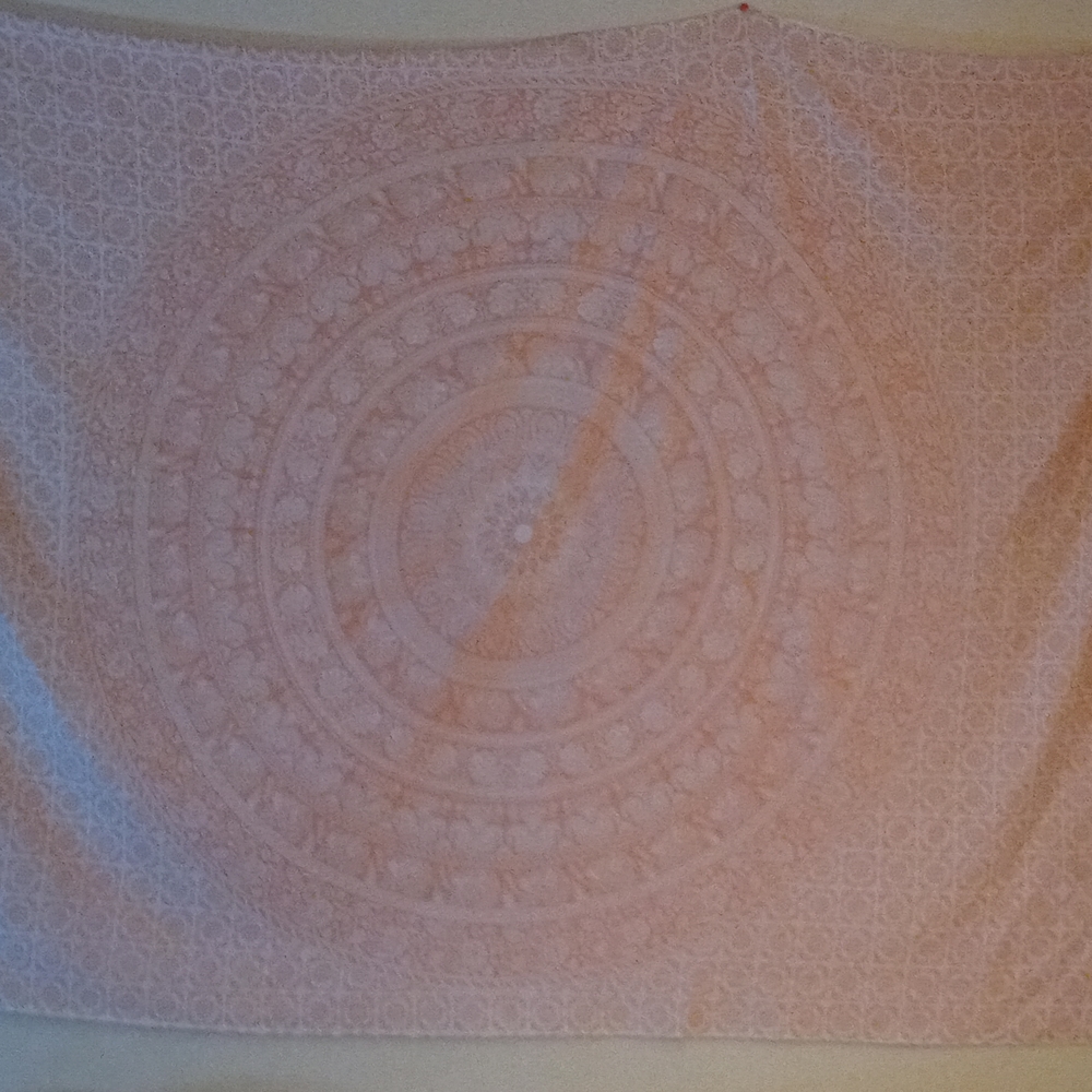 A light pink tapestry